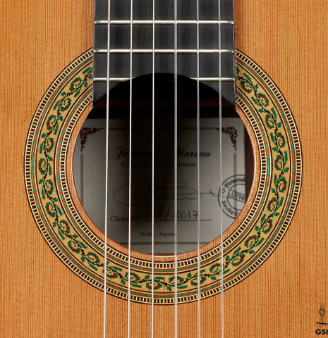 The rosette of a 2017 Fernando Moreno classical guitar made of cedar and Indian rosewood