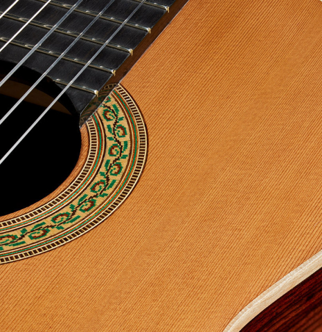 The soundboard and rosette of a 2017 Fernando Moreno classical guitar made of cedar and Indian rosewood