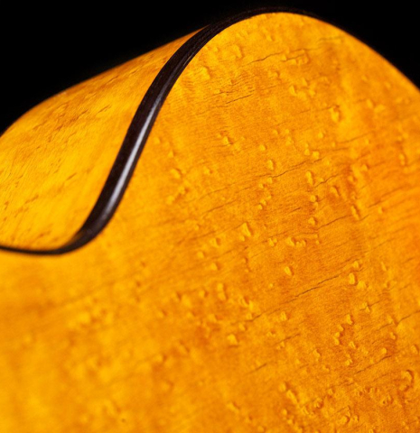 The birdeye maple back and sides of a The rosette of a 1894 Hijos de Melchor de Moya guitar made of spruce