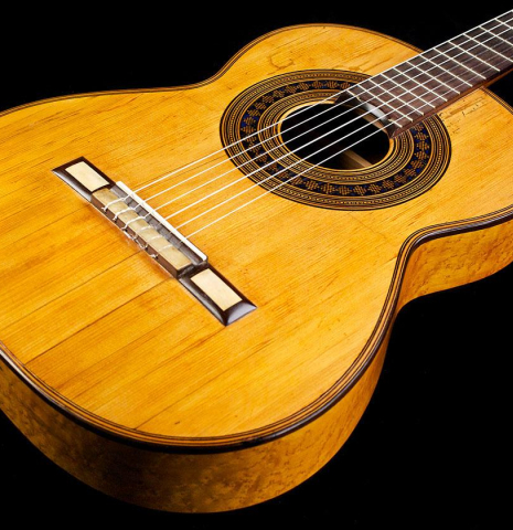 The front and bridge of a 1894 Hijos de Melchor de Moya guitar made of spruce and maple