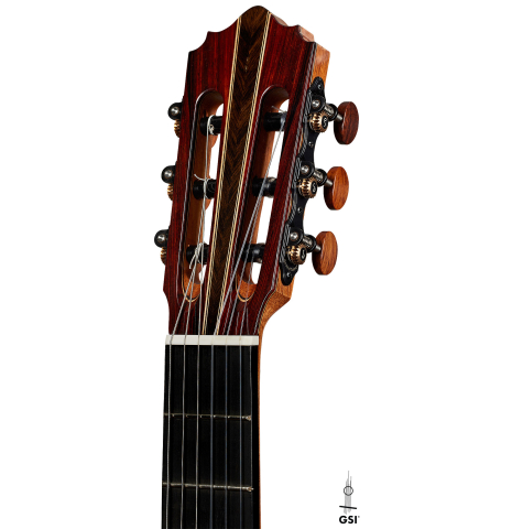 The headstock of a 2025 Oscar Munoz classical guitar made of cedar and African rosewood