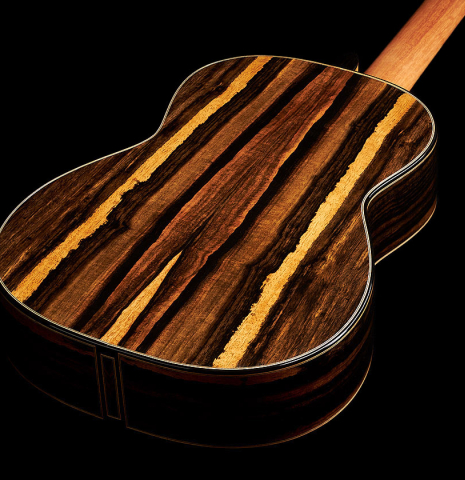 The back and sides of a 2024 Oscar Munoz classical guitar made of spruce and Makassar ebony