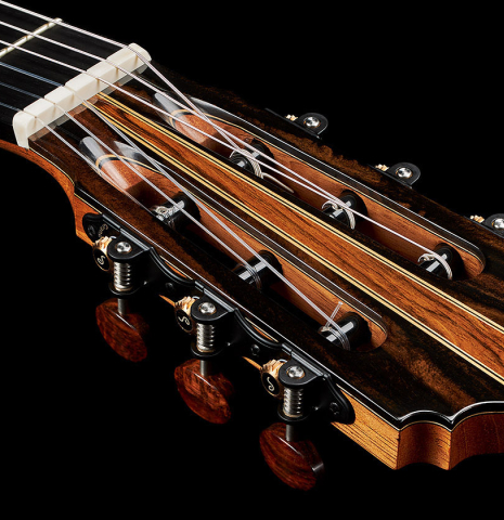 The headstock and tuning machines of a 2024 Oscar Munoz classical guitar made of spruce and Makassar ebony