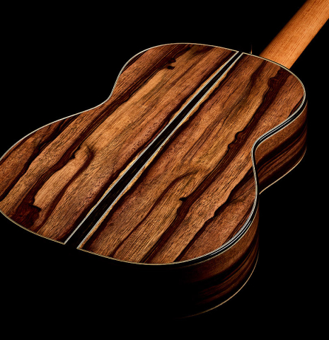 The back and sides of a 2026 Oscar Munoz classical guitar made of spruce and Makassar ebony