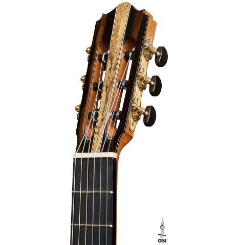 The headstock of a 2026 Oscar Munoz classical guitar made of spruce and Makassar ebony