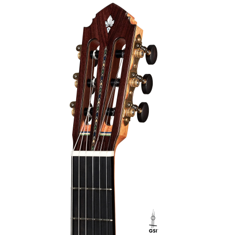 The headstock of a 2022 Miguel Angel Gutierrez classical guitar made of spruce and Indian rosewood.
