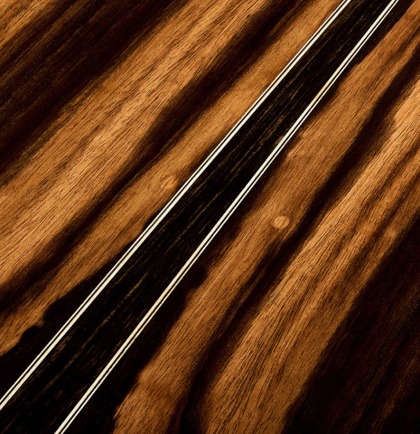 The back center seam of a 2026 Oscar Munoz classical guitar made of cedar and Makassar ebony