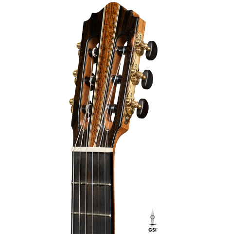 The headstock of a 2026 Oscar Munoz classical guitar made of cedar and Makassar ebony