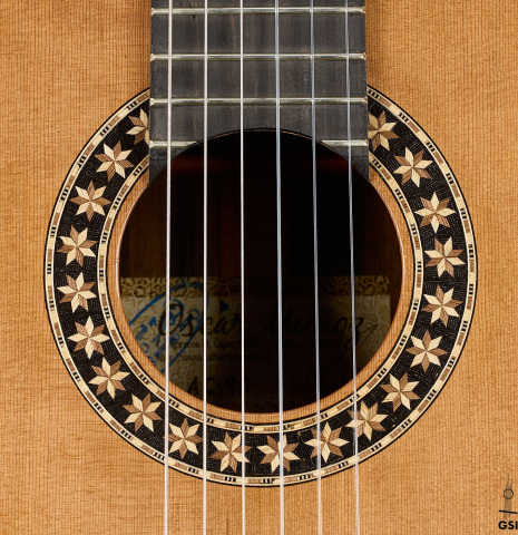 The rosette of a 2026 Oscar Munoz classical guitar made of cedar and Makassar ebony