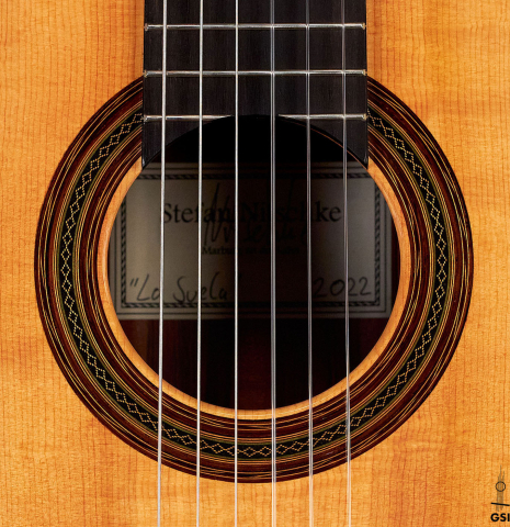 The rosette of a 2022 Stefan Nitschke "Hauser" classical guitar made with spruce and CSA rosewood