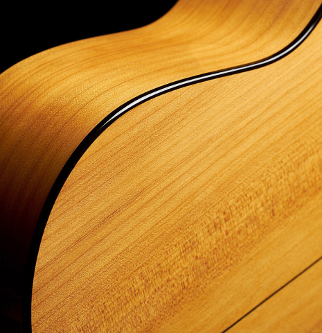The back, sides and binding of a 2023 Stefan Nitschke "Vicente Arias" classical guitar made of spruce and cypress