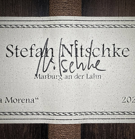 The label of a 2024 Stefan Nitschke "Santos" classical guitar made of spruce and CSA rosewood