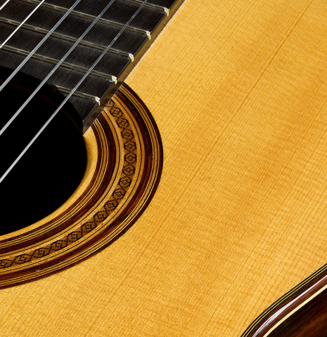 The soundboard and rosette of a 2024 Stefan Nitschke "Santos" classical guitar made of spruce and CSA rosewood