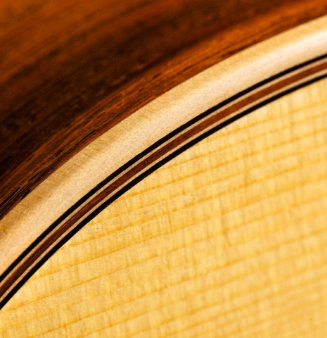The top binding and purfling of a 1992 Ober/Blochinger classical guitar made of spruce and CSA rosewood