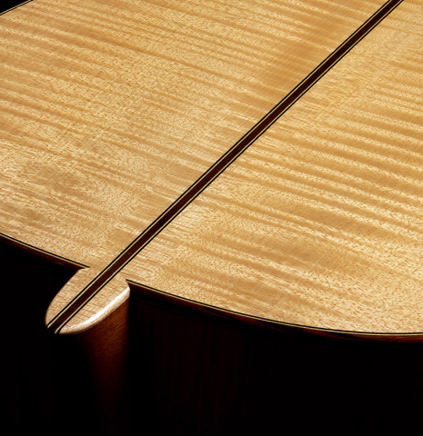 The heel, back binding and purfling of a 2000 Fritz Ober classical guitar made of spruce and maple