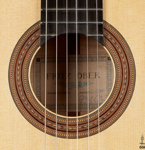The rosette of a 2000 Fritz Ober classical guitar made of spruce and maple