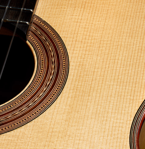 The top and rosette detail of a 2000 Fritz Ober classical guitar made of spruce and maple
