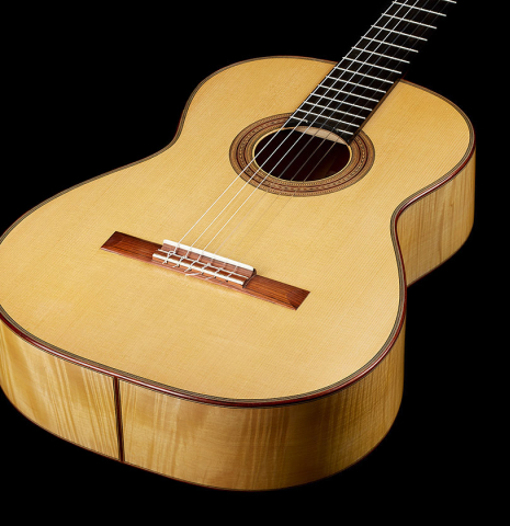 The top and sides of a 2000 Fritz Ober classical guitar made of spruce and maple