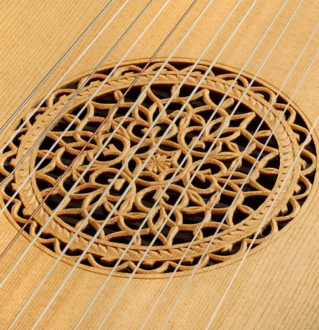 The ornately carved headstock of a 1988 Fritz Ober "7-Course Renaissance Lute" made of spruce and yew