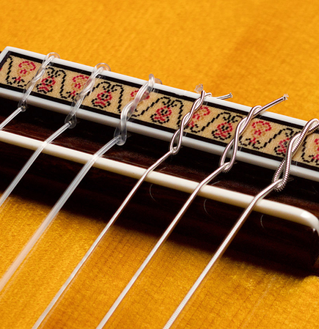 The bridge and saddle of a 2004 Jose Oribe &quot;Suprema&quot; classical guitar made of spruce and CSA rosewood