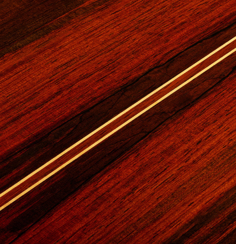 The back center seam of a 1977 Jose Oribe "Calidad Suprema" classical guitar made of cedar and CSA rosewood