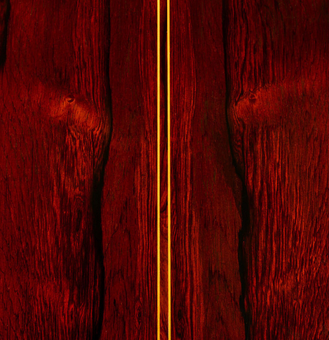 The back center seam of a 1985 Jose Oribe "Calidad Suprema" classical guitar made of cedar and CSA rosewood