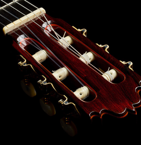 The headstock veneer and tuning machines of a 1985 Jose Oribe "Calidad Suprema" classical guitar made of cedar and CSA rosewood