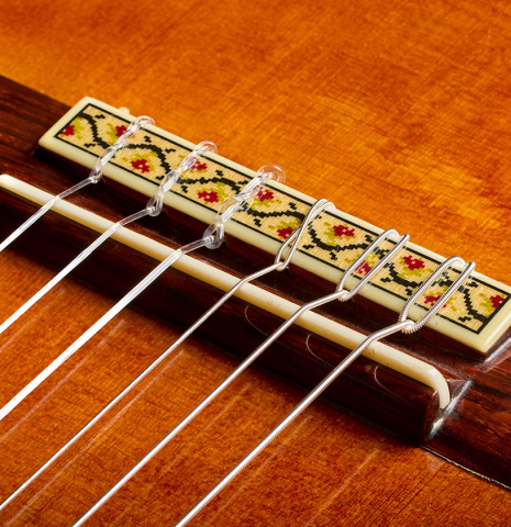 The bridge, tie-block and saddle of a 1987 Jose Oribe "Gran Suprema" (ex Scott Tennant) classical guitar made of cedar and CSA rosewood