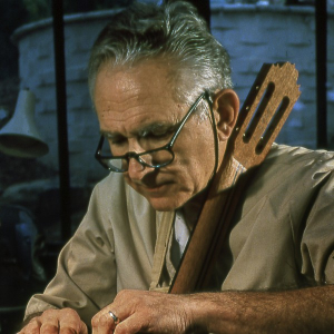 José Oribe at his workbench, working on the body of a classical guitar