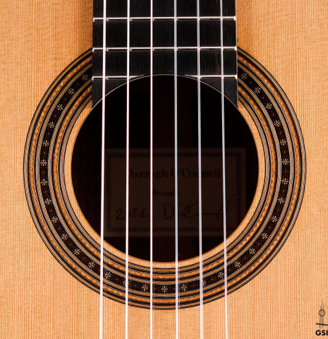 The rosette of a 2021 Darragh O'Connell classical guitar made of cedar and Indian rosewood