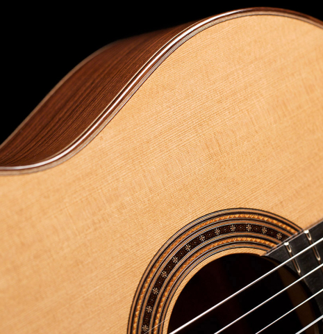 The soundboard and rosette of a 2021 Darragh O'Connell classical guitar made of cedar and Indian rosewood