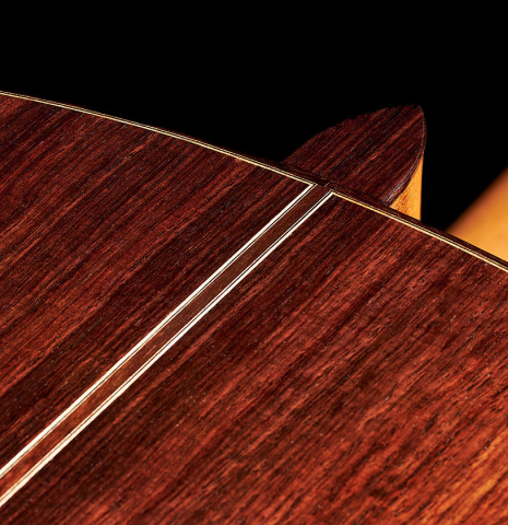 The back, center seam and heel of a 2023 Darragh O'Connell classical guitar made of cedar and Indian rosewood