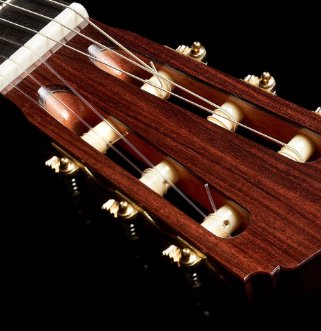 The headstock and tuning machines of a 2023 Darragh O'Connell classical guitar made of cedar and Indian rosewood