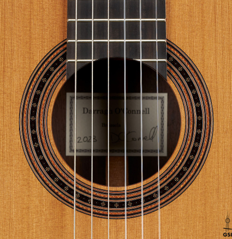 The rosette of a 2023 Darragh O'Connell classical guitar made of cedar and Indian rosewood