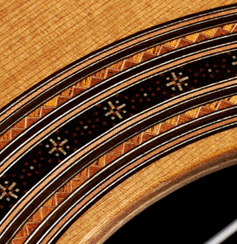 Detail of the rosette of a 2023 Darragh O'Connell classical guitar made of cedar and Indian rosewood