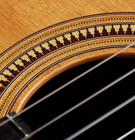 Detailed close-up of the rosette of a 2017 David Pace "Double-Top SP/SP" classical guitar made of Sitka spruce and Indian rosewood
