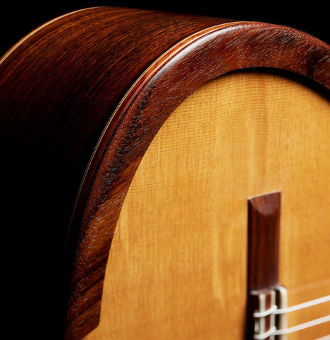 The soundboard, side and arm-rest of a 2017 David Pace "Double-Top SP/SP" classical guitar made of Sitka spruce and Indian rosewood