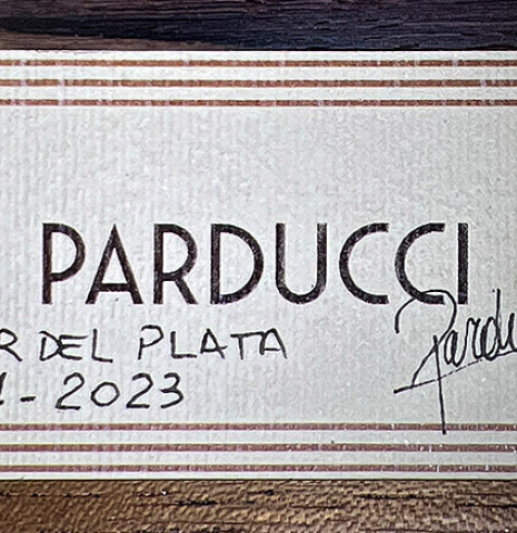 This is the label of a 2023 Alexis Parducci classical guitar made with spruce and African rosewood.