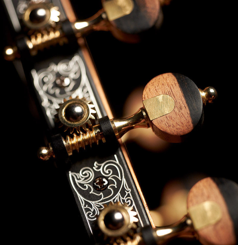 These are the tuning machines of a 2023 Alexis Parducci classical guitar made with spruce and African rosewood.