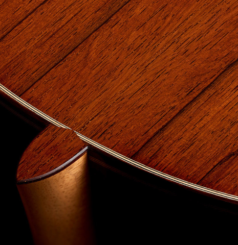 The heel, back binding and purflings of a 2026 Alexis Parducci classical guitar made of spruce and African rosewood