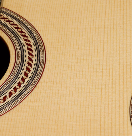 The soundboard and rosette detail of a 2026 Alexis Parducci classical guitar made of spruce and African rosewood
