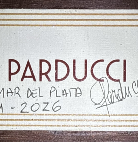 The label of a 2026 Alexis Parducci classical guitar made of spruce and African rosewood
