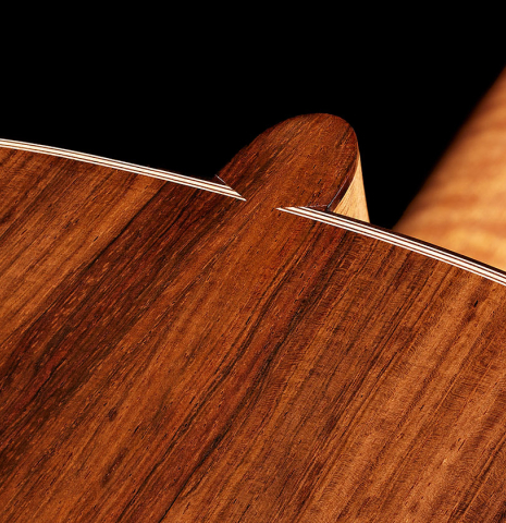 The heel, back binding and purfling of a 2024 Alexis Parducci "Llobet" classical guitar made of spruce and CSA rosewood