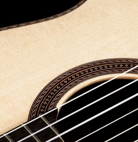 The top and rosette detail of a 2024 Alexis Parducci "Llobet" classical guitar made of spruce and CSA rosewood