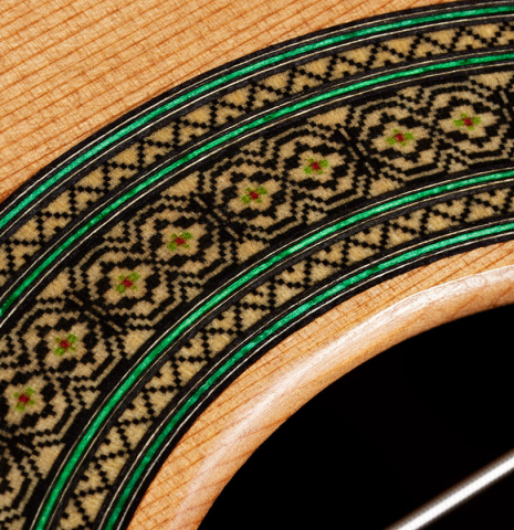 Detailed close-up of the rosette of a 2024 Teodoro Perez "Maestro" classical guitar made of cedar and African rosewood