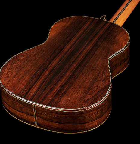 The back and sides at the foot of a 2024 Teodoro Perez "Maestro" classical guitar made of spruce and African rosewood