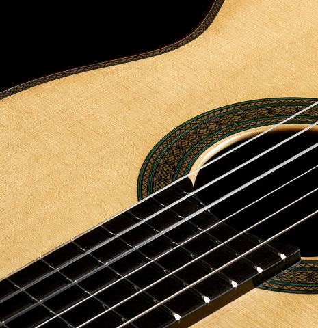 Closeup of rosette and top of a 2024 Teodoro Perez "Maestro" classical guitar made of spruce and African rosewood