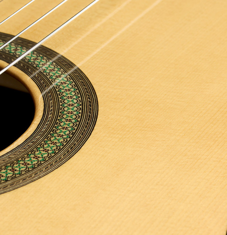 The soundboard and rosette of a 2025 Teodoro Perez "Concierto" classical guitar made of spruce and African rosewood