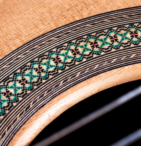 The rosette of a 2023 Teodoro Perez &quot;Concierto&quot; classical guitar made of cedar and Indian rosewood.