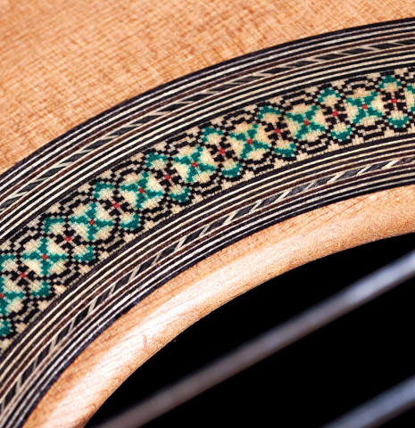 The rosette of a 2023 Teodoro Perez "Concierto" classical guitar made of cedar and Indian rosewood.